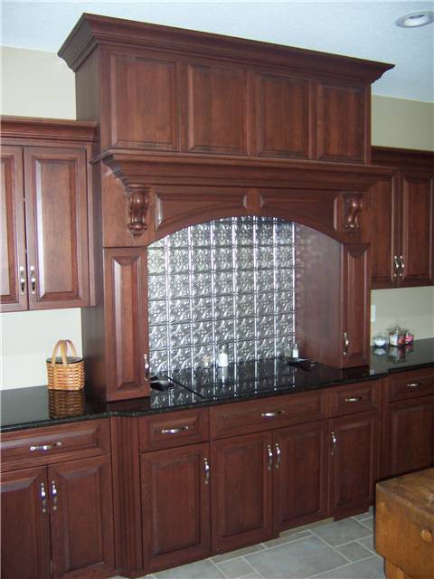 Cherry cooking enclosure - Raised panels miter corner - Full overlay style - Granite countertops